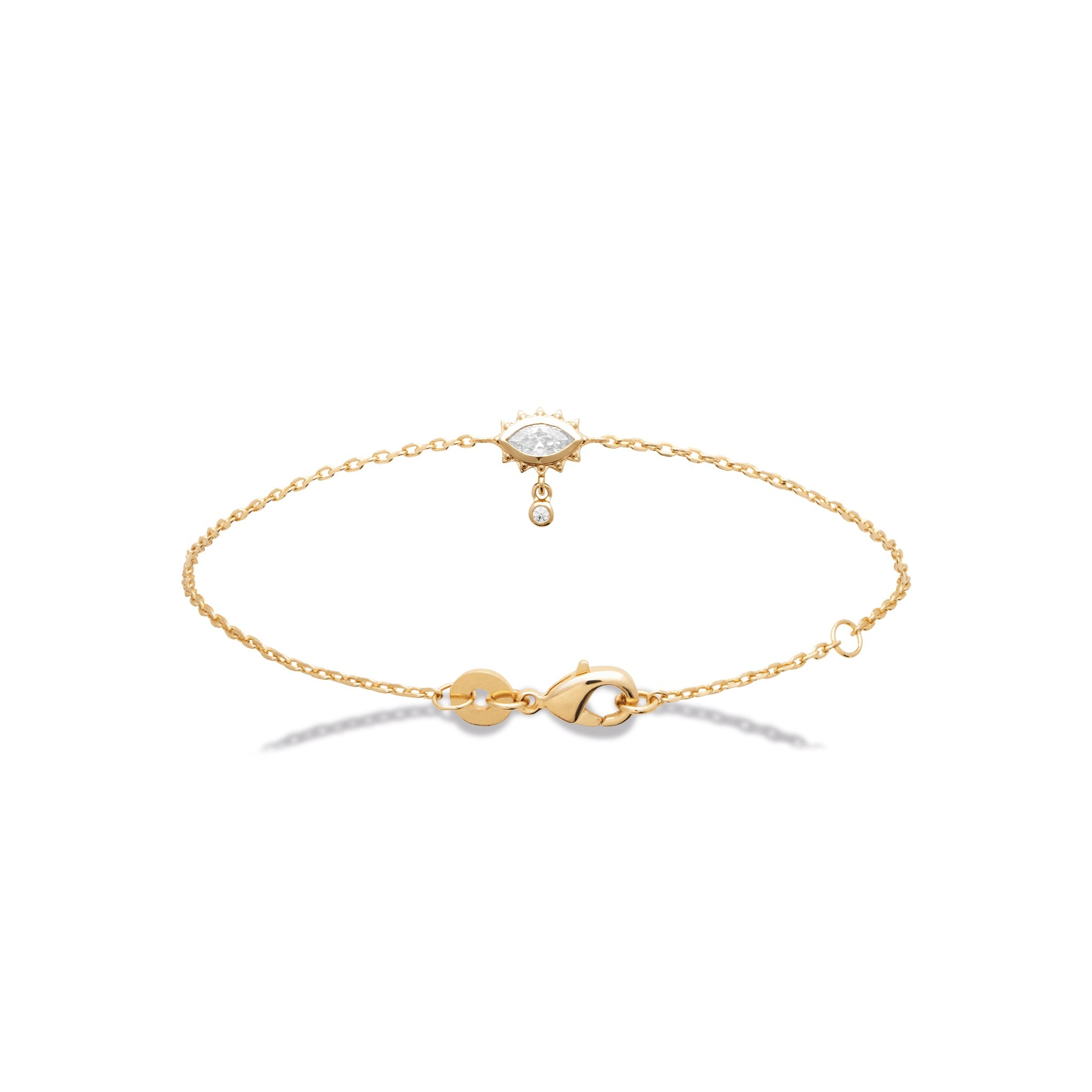 Bracelet doré chaîne avec œil orné d’un zircon et petit zircon pendant - Bijou photographié sur fond blanc 