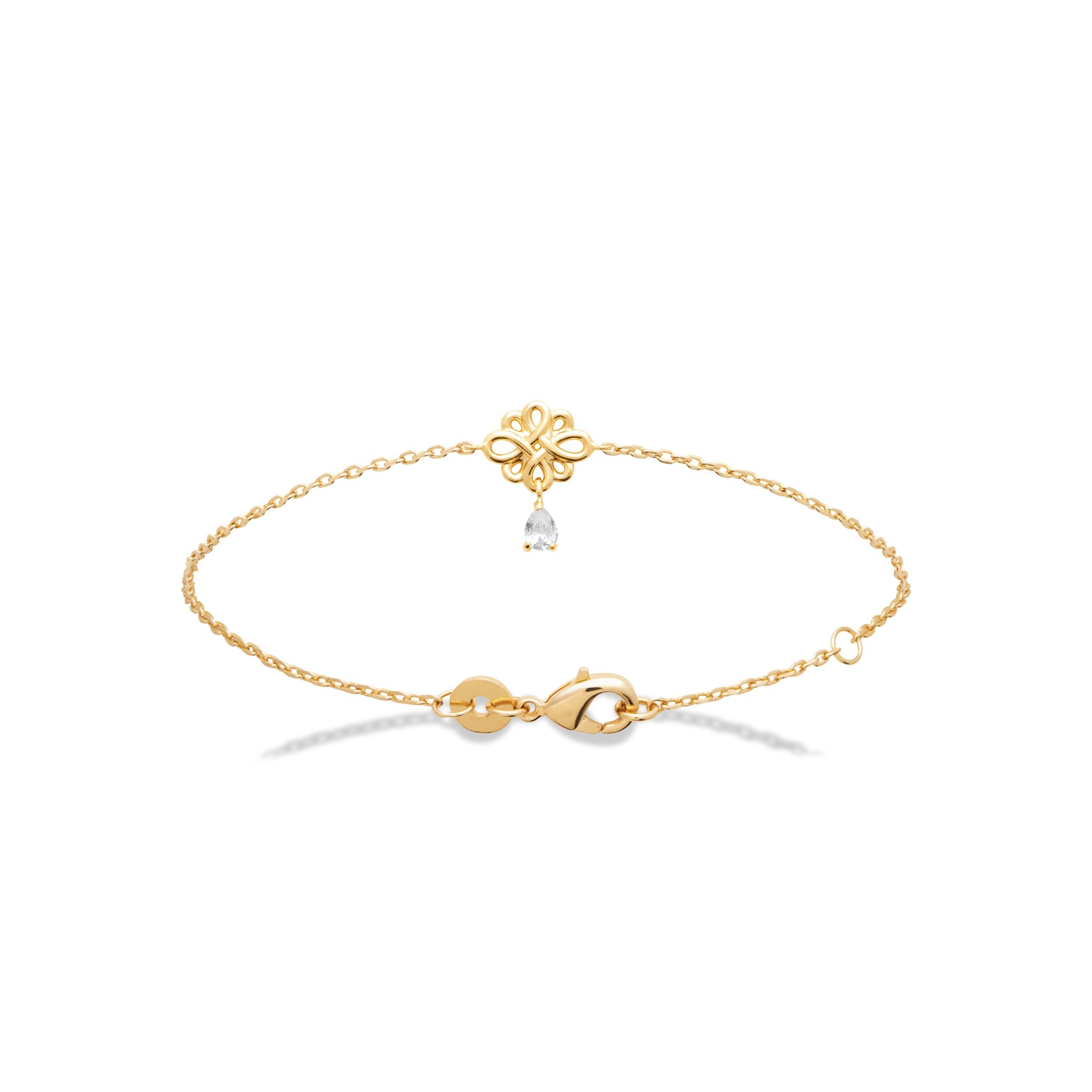 Bracelet doré avec un pendentif nœud de l’infini et un zircon en forme de goutte suspendu - Bijou photographié sur fond blanc 