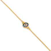 Bracelet doré oeil serti de zircons bleus et blancs - Bijou photographié sur fond blanc 