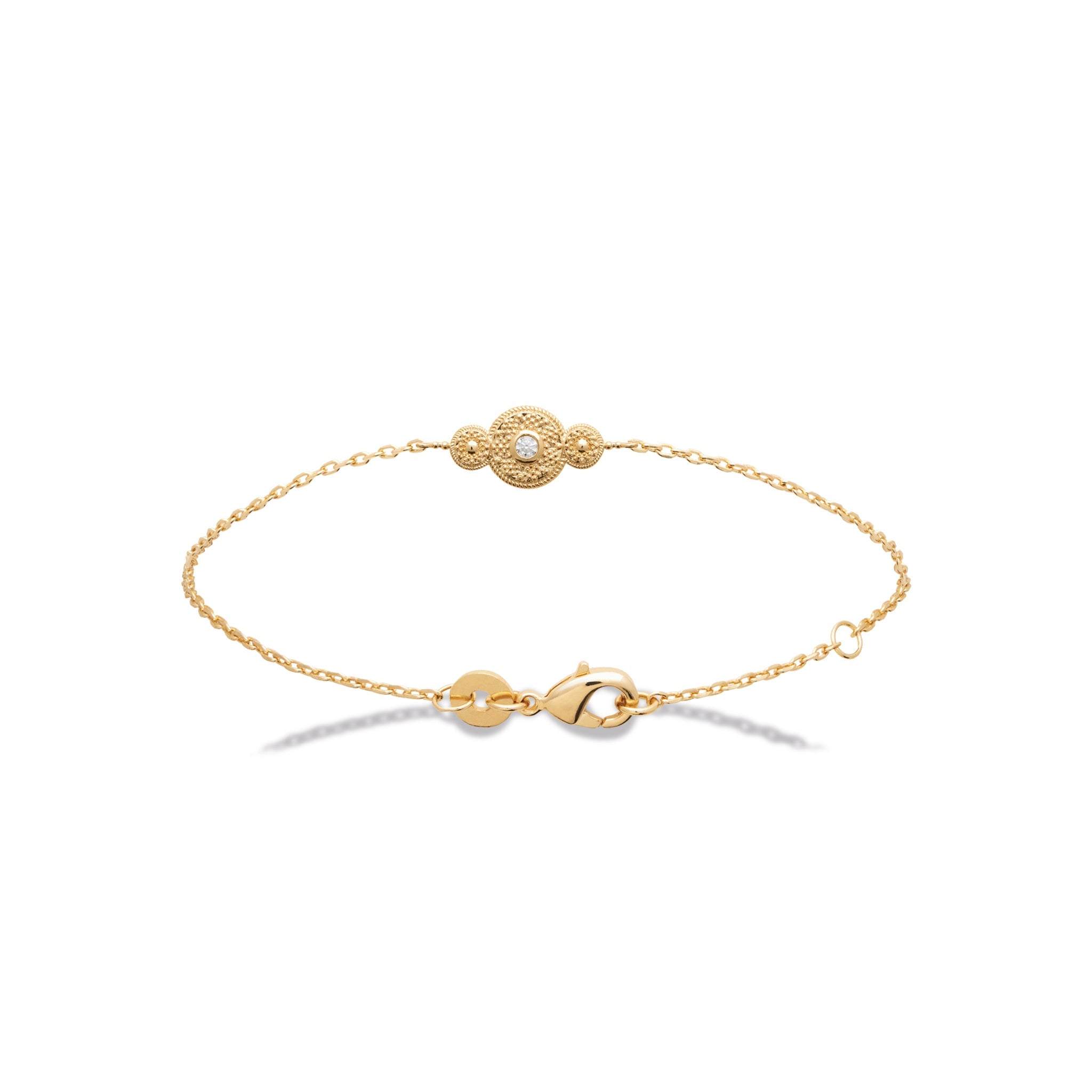 Bracelet doré orné d'un zircon - Bijou photographié sur fond blanc 