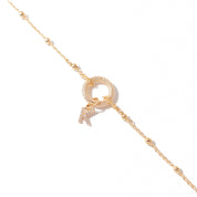 Bracelet personnalisable doré zircons charms et initiales Oka - Bijou photographié sur fond blanc