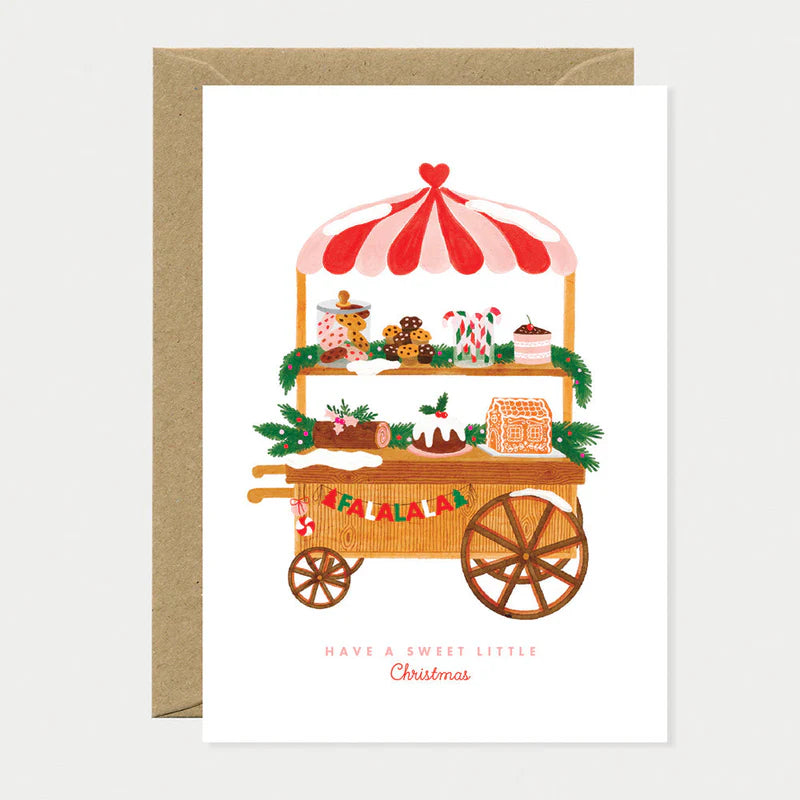 Carte de Noël en papier naturel blanc avec un chariot rempli de pâtisseries de Noël - Papeterie