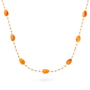 Collier sautoir doré Estelle cornaline orné de pierres naturelles - Bijou photographié sur fond blanc