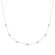 Collier Sol argent mini soleil - Bijou photographié sur fond blanc. 