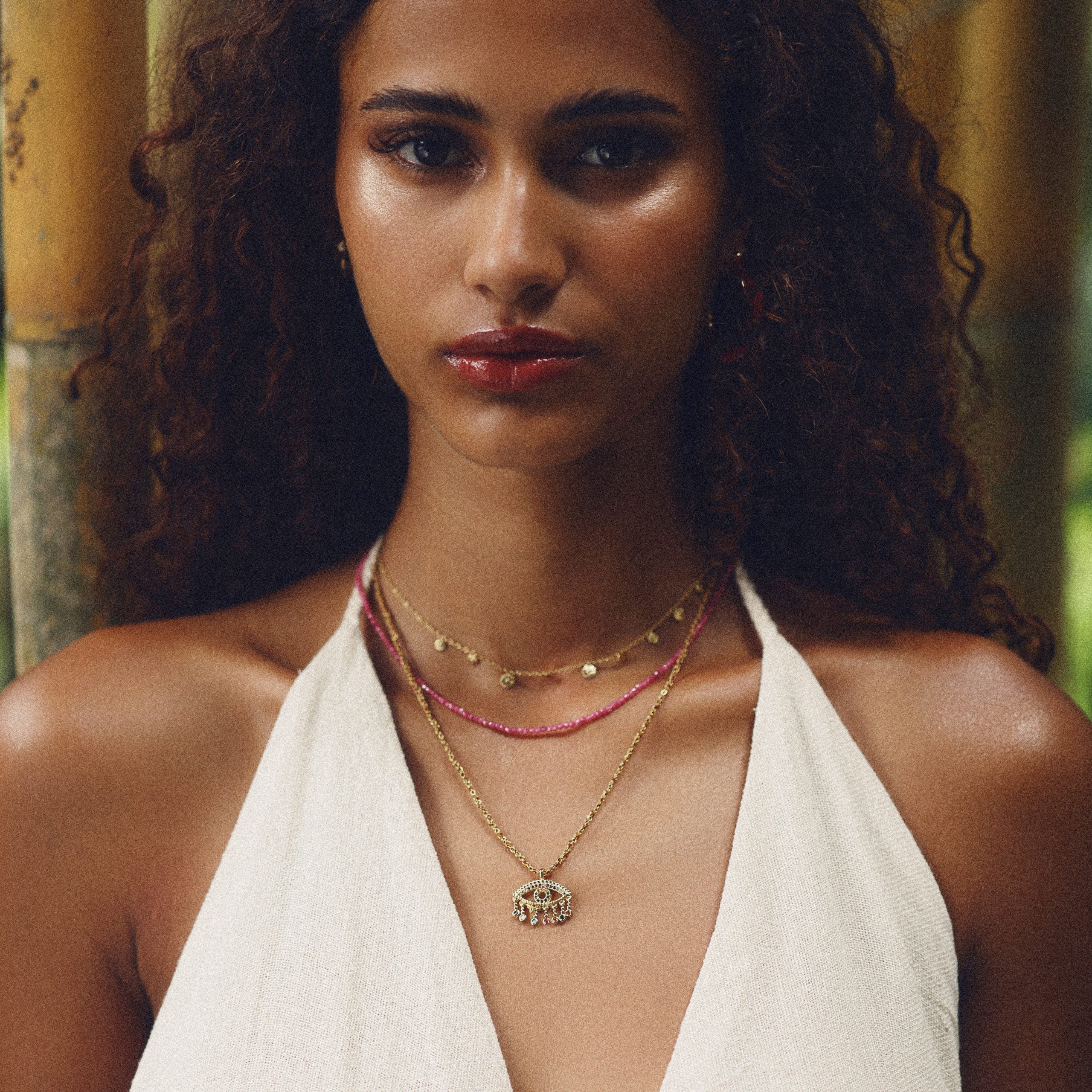 Collier doré pendentif oeil zircons Auri