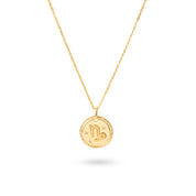 Collier doré signe astrologique Capricorne - Bijou photographié sur fond blanc