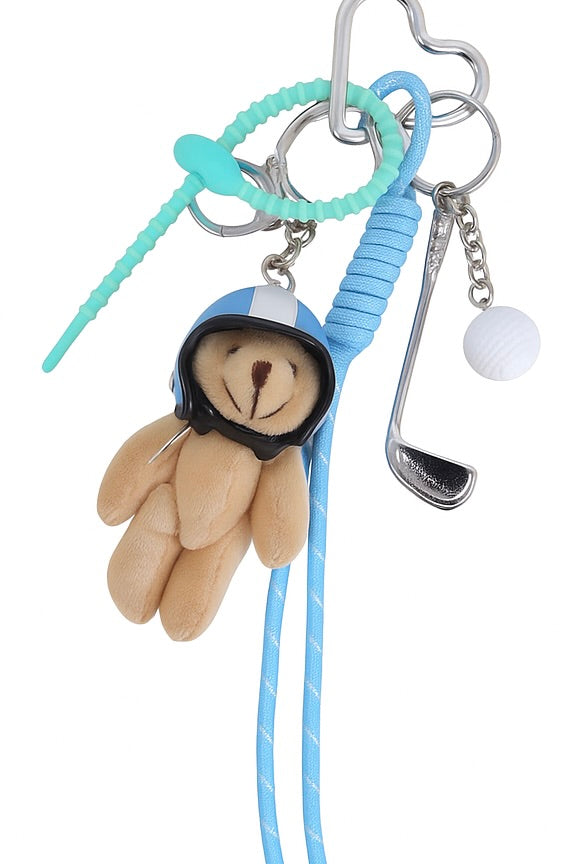 Bijou de sac ourson avec un casque blanc et bleu, une balle de golf et un mini club de golf à porter sur un sac ou en porte-clé - Photographié sur fond blanc