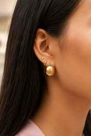 Boucles d’oreilles dorées Carry en acier inoxydable en forme de croissant - Bijou porté