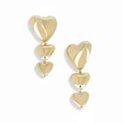 Boucles d'oreilles pendantes Raelle dorées cœurs - Bijou photographié sur fond blanc