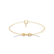 Bracelet doré Minnie fer à cheval serti de zircons avec pendentif - Bijou photographié sur fond blanc