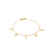 Bracelet doré Cléo orné de pampilles dauphin, tortue, poisson, étoile de mer et méduse - Bijou sur fond blanc