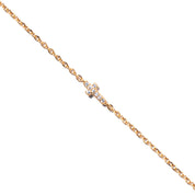  Bracelet doré mini croix zircons Xael - Bijou photographié sur fond blanc