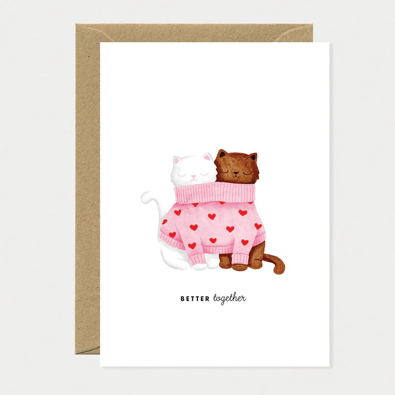 Carte de voeux en papier naturel blanc avec deux chats dans un même pull rose avec des coeurs - Papeterie