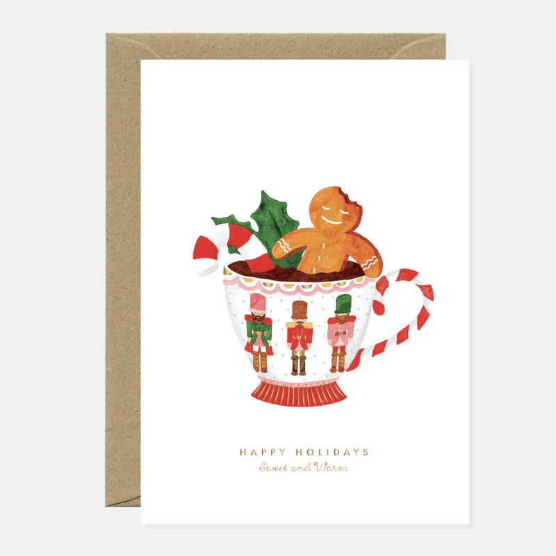 Carte de Noël en papier naturel blanc avec un biscuit de Noël qui prend un bain dans un chocolat chaud - Papeterie