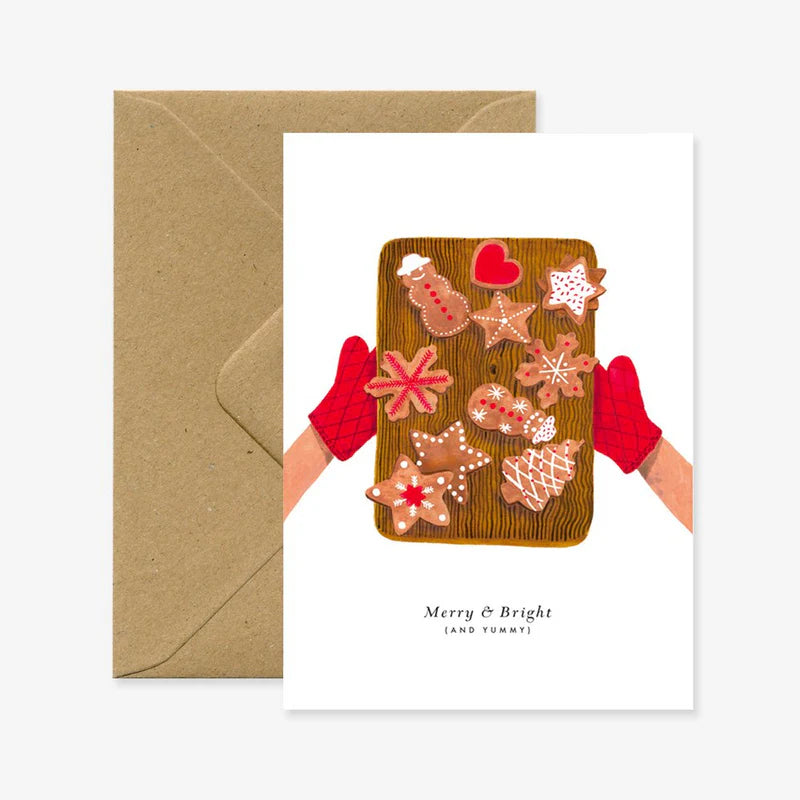 Carte de Noël en papier naturel blanc avec un plateau sortant du four rempli de biscuits de Noël - Papeterie