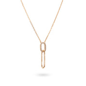 Collier doré Nadja pendentif trombone serti de zircons - Bijou sur fond blanc