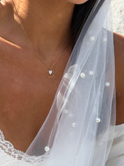 Collier doré Rama avec pendentif cœur en nacre et anneau - Bijou porté