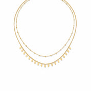  Collier double doré Amber composé d'une chaîne perlée et d'une chaîne ornée de pampilles ovales - Bijou photographié sur fond blanc