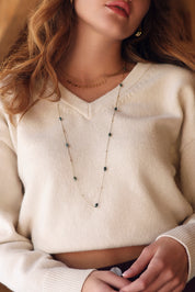  Collier double doré Amber composé d'une chaîne perlée et d'une chaîne ornée de pampilles ovales - Bijou porté