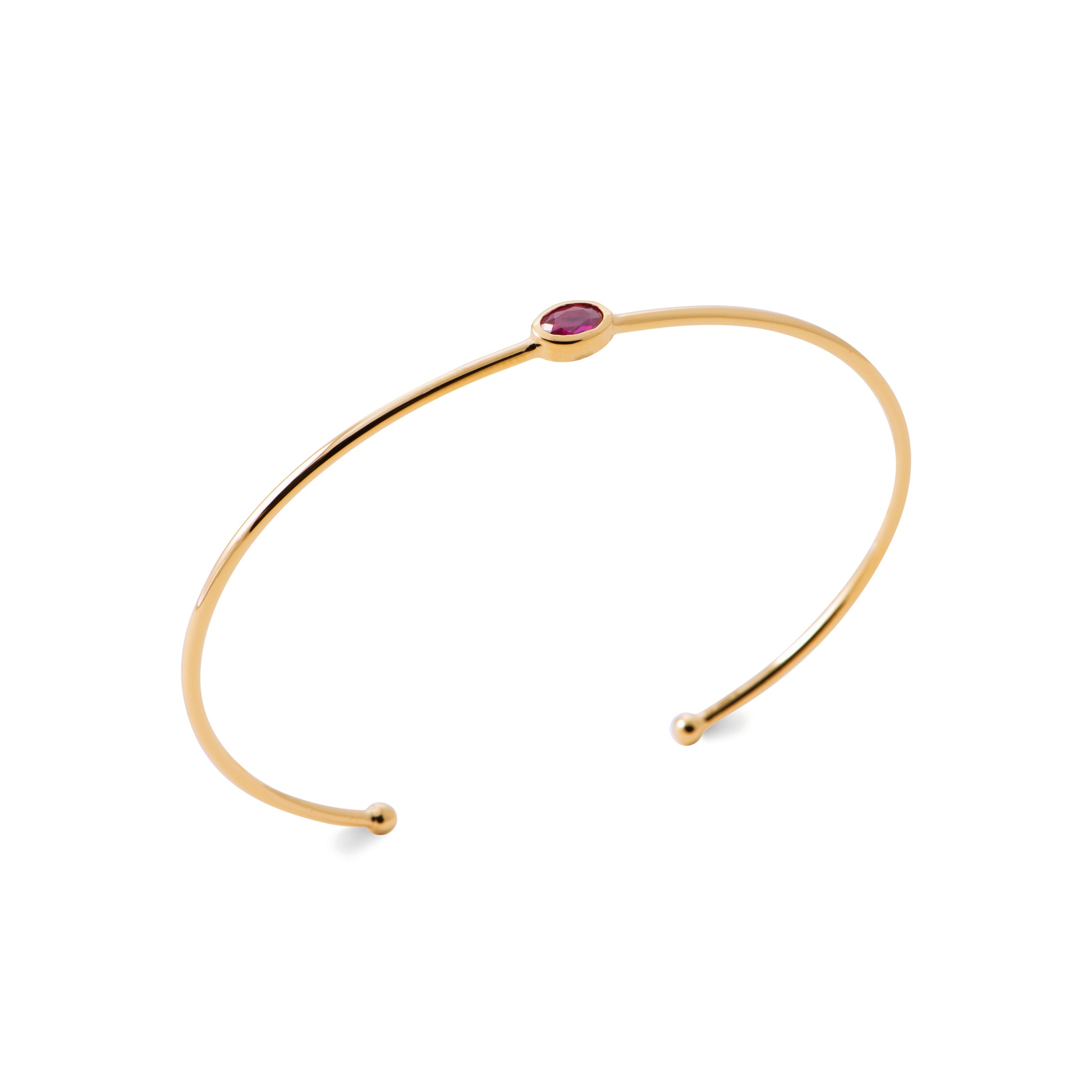 Bracelet jonc doré Lupo orné d'un zircon fuchsia - Bijou photographié sur fond blanc