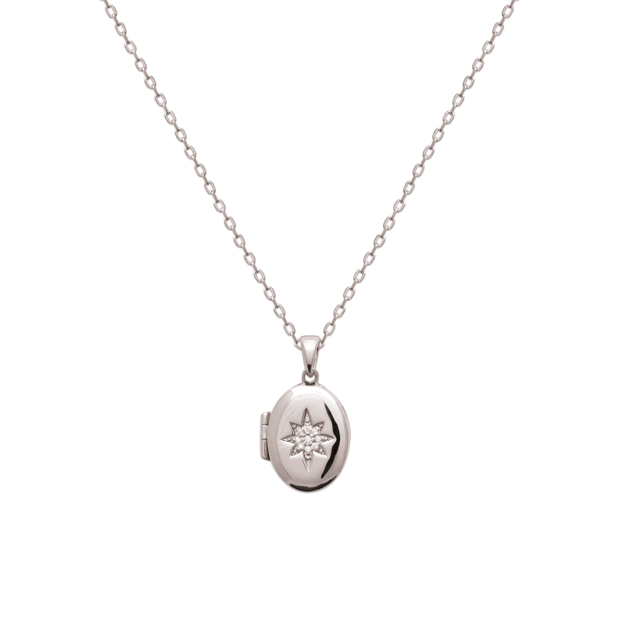 Médaillon ouvrant Elvira argent ovale avec étoile polaire sertie de zircons - Bijou photographié sur fond blanc